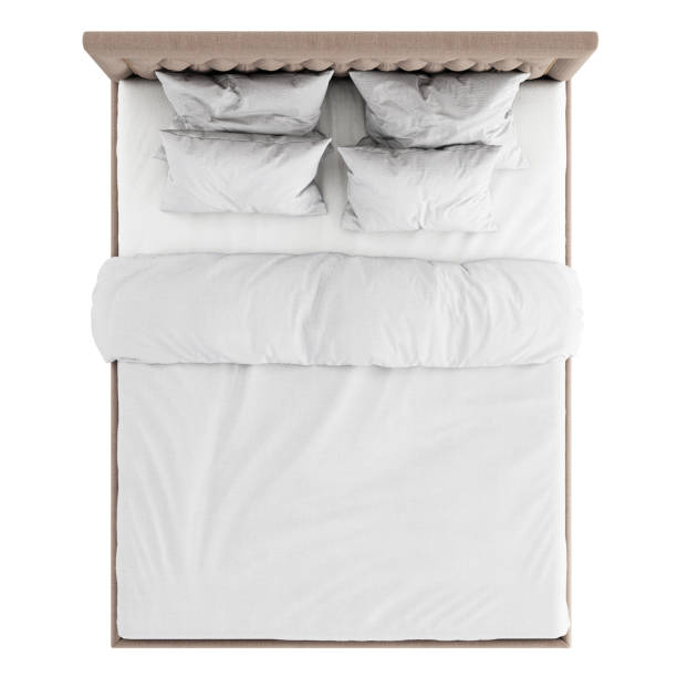 istock Double bed in a classic style with soft beige quilted upholstery and white bedding on a white background. Top view. 3d rendering 1199283701