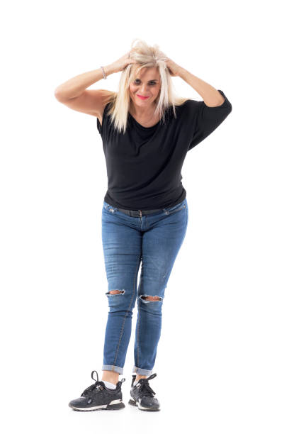 istock Playful charming pretty middle age frustrated woman messing up and pulling hair 1199284027