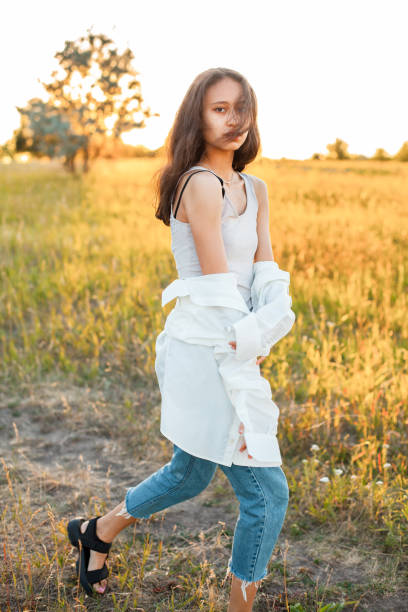 istock Young woman is posing outdoors 1199287165
