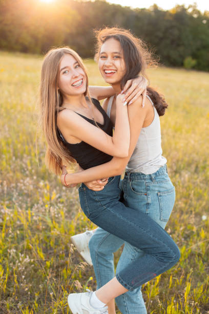 istock Two girls having fun outdoors 1199287268