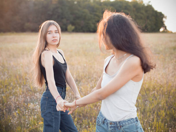 istock Two young women having fun on the field 1199287362