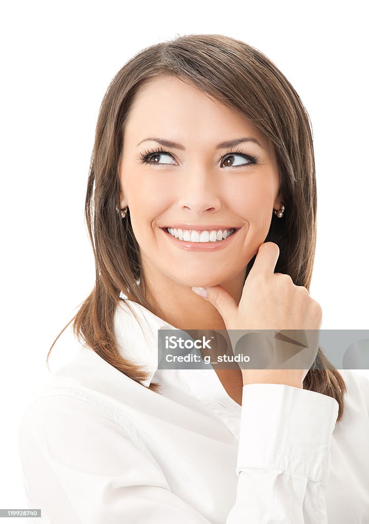 Portrait of smiling thinking businesswoman, isolated on white background  Adult Stock Photo