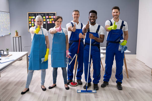 istock Janitors Showing Thumb Up Sign In The Office 1199289518