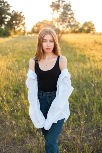 istock Young woman posing outdoors 1199289626
