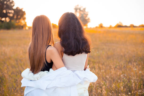 istock Two young women looking on the sunset 1199289641