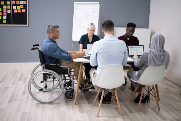 istock Disabled Businessman In Conference Room 1199289760