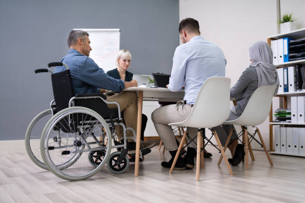istock Disabled Businessman In Conference Room 1199289789