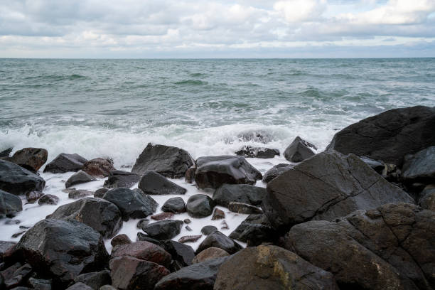 istock Waves hitting to rocks creating magnificent view seashore in Blacksea 1199289796
