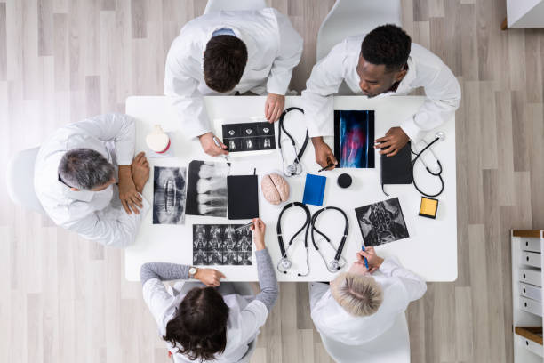 istock Doctors Looking At X-ray Images 1199289835