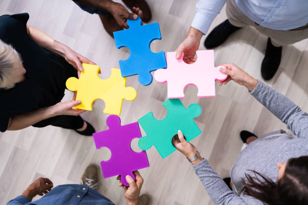 istock Businesspeople Holding Jigsaw Puzzle 1199289845