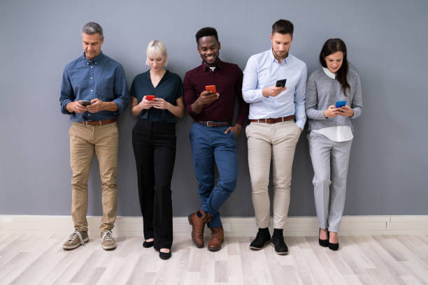 istock Happy Businesspeople Using Smartphones 1199289860