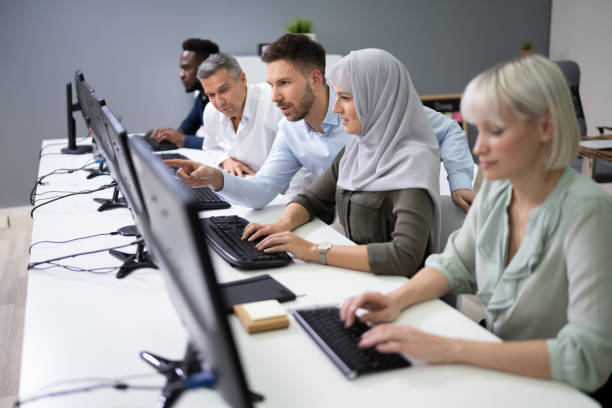 istock Manager Assisting His Staff In Office 1199290998