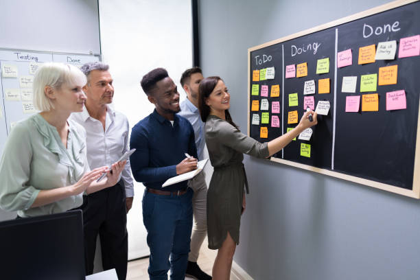 istock Group Of People Writing On Sticky Notes 1199291024