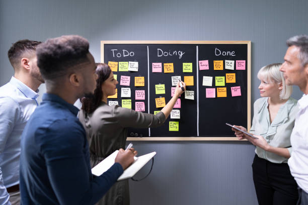 istock Group Of People Writing On Sticky Notes 1199291028