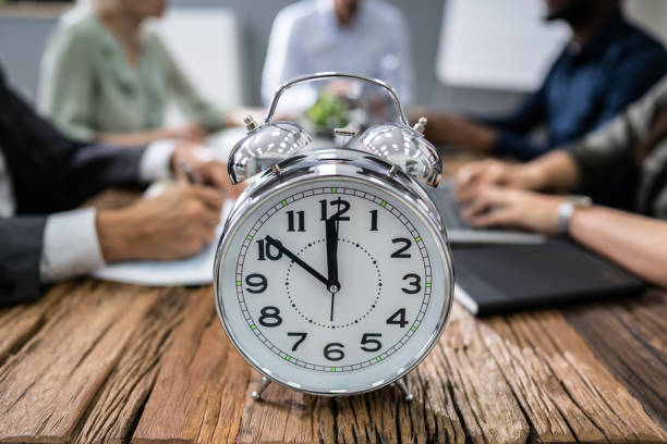 istock Close-up Of Alarm Clock On Desk 1199291068