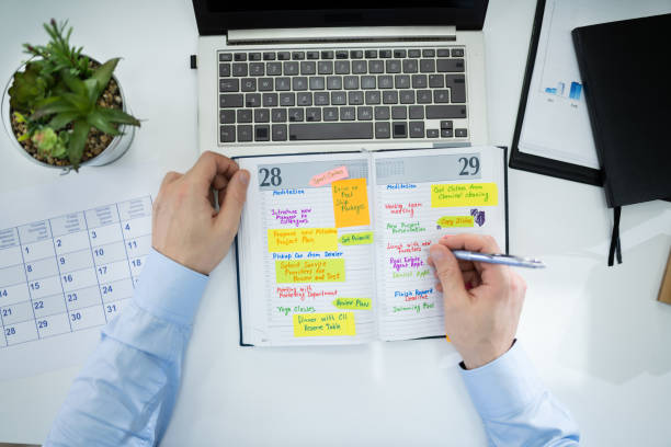 istock Businessman Making Agenda On Personal Organizer 1199291191