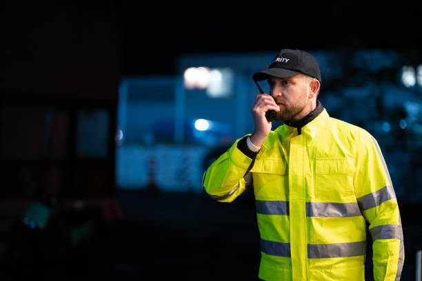 istock Young Security Guard Talking On Walkie-talkie 1199291255