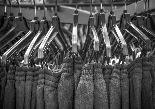 Black sweatpants on the clothes rail in a row