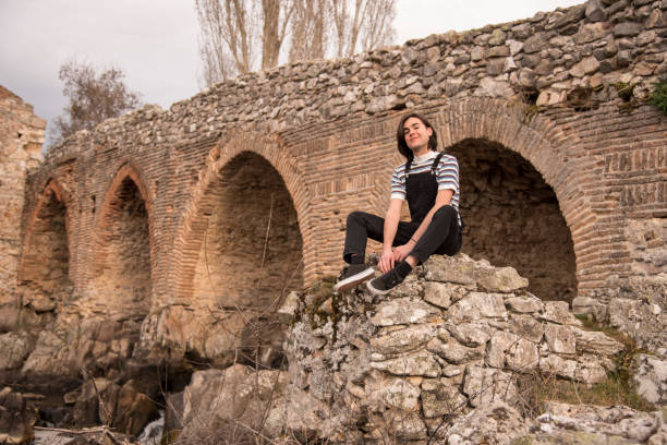 istock Young man posing in the field and with a bridge in the background 1199291488