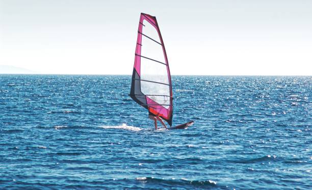istock Windsurfing on blue sea 1199293857