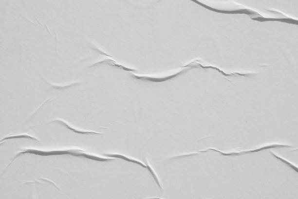 istock White glued paper close-up. Abstract background. 1199294192