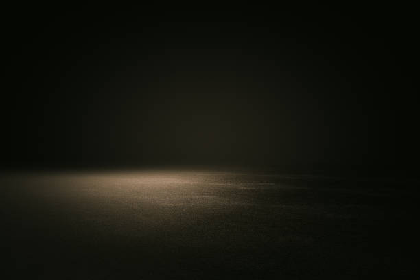 istock Abstract empty spacious place for presentation with dark wall and floor and spot light from above. 1199295026