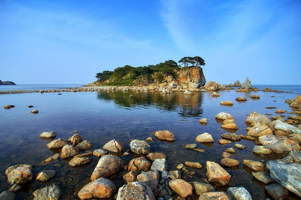 istock Rocky high island in the ocean. 1199295644