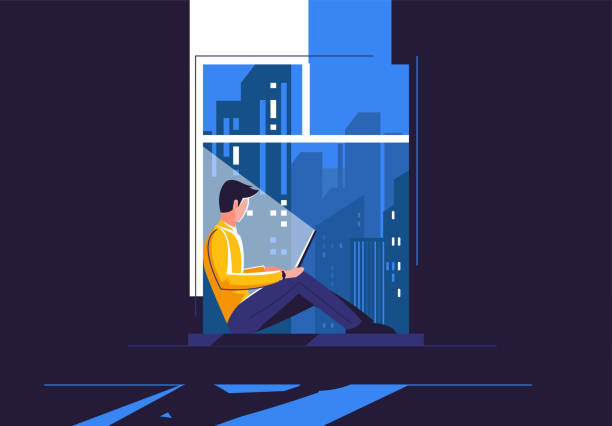 A young man is sitting on the windowsill with a laptop, in the dark against the background of the night city outside the window A young man is sitting on the windowsill with a laptop, in the dark against the background of the night city outside the window looking through window stock illustrations