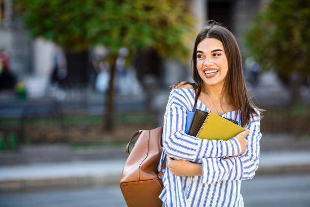 istock Smart female college student on campus outdoors. 1199299432