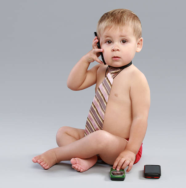 istock Young businessman talk on cell phone in a tie 119930026