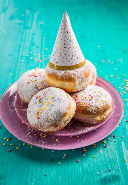 istock Carnival powdered sugar raised donuts - German Berliner donuts 1199301735