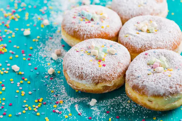Photo of Carnival powdered sugar raised donuts - German Berliner donuts