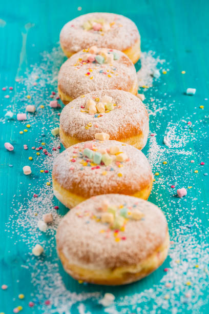 istock Carnival powdered sugar raised donuts - German Berliner donuts 1199301750