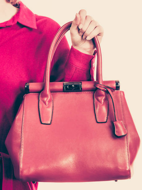 istock Female holding brown leather bag 1199303474