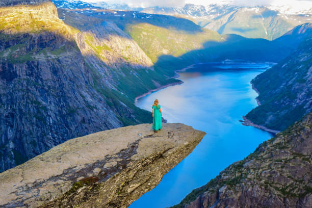 istock The tourist on the Trolltunga, Norway. 1199303636