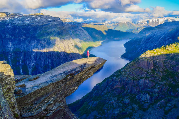 istock Girl on Trolltunga, Notway. 1199303822
