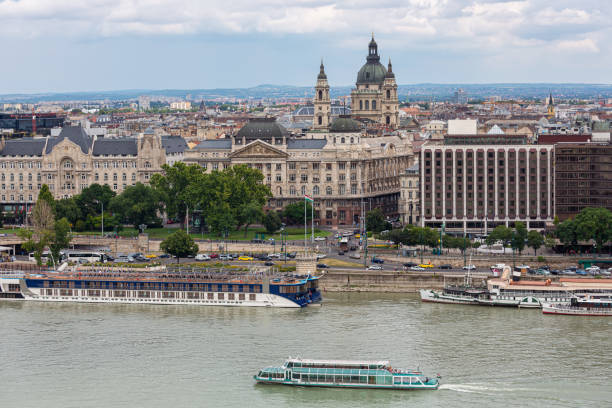 View at Budapest skyline with St. Stephen Basilica building and launch ships at Danube river