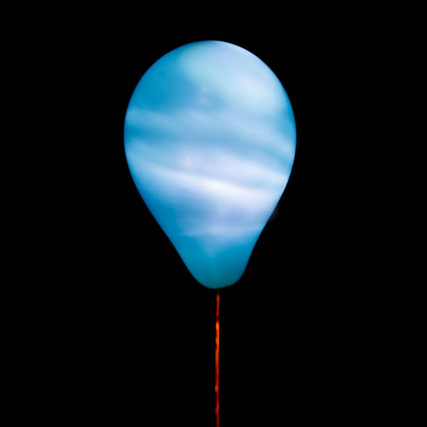 istock Blue balloon illuminated with intern LED light against dark background 1199306005