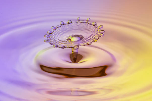 istock High speed water drop photograph with colliding drops 1199306186