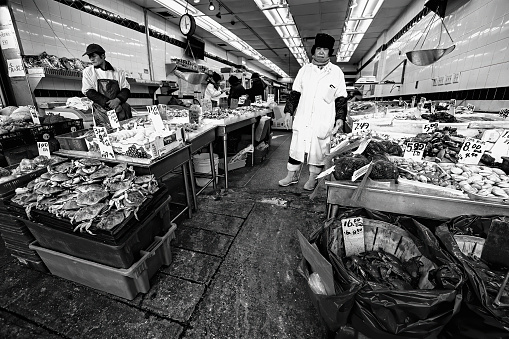 China Town, New York, NY, USA - November 30, 2019. Fish market in China Town - Manhattan, New York. Black and white image.