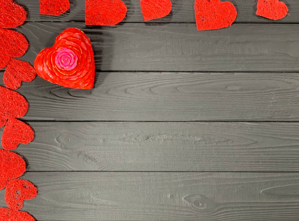 istock Hearts of different sizes on a black background. 1199308491