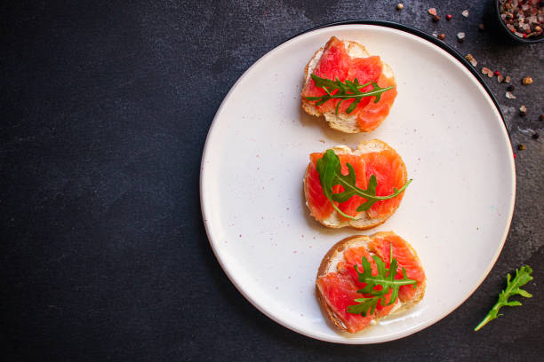 istock sandwich salmon smorrebrod (delicious snack seafood fish) menu concept. food background. top view. copy space 1199309774