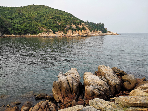 Bay with rocks at Cheung Chau, a small island 10 km southwest off Hong Kong Island.