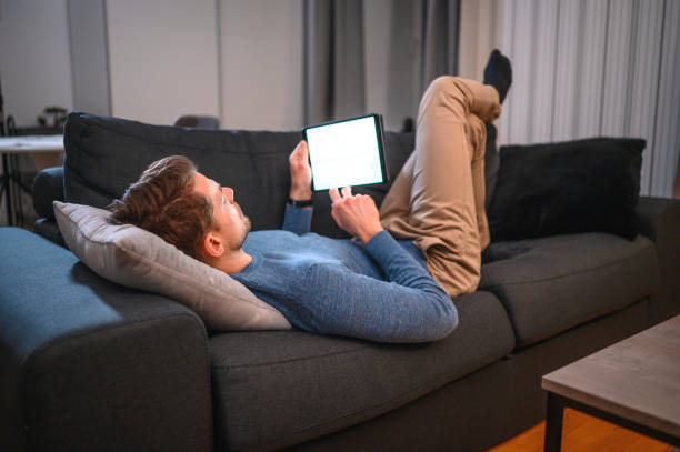 istock Mature Man Using Digital Tablet At Home 1199313742