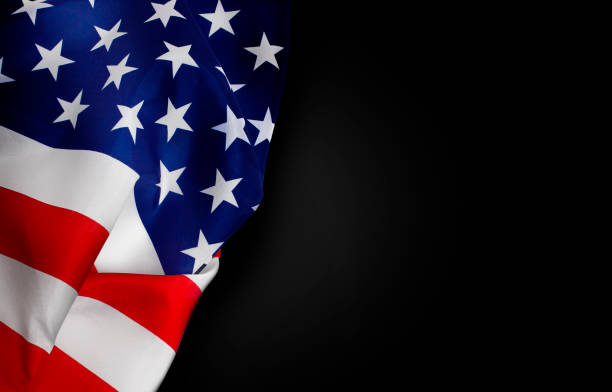 istock American flag isolated on black backgroun 1199319995