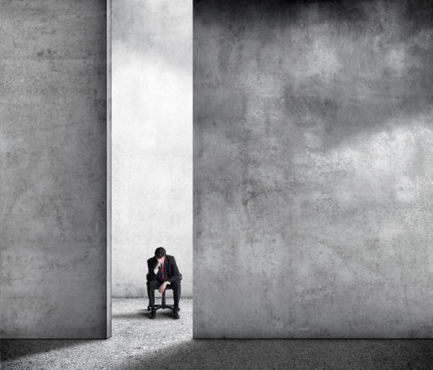istock Depressed Man Sitting In Chair 1199322654