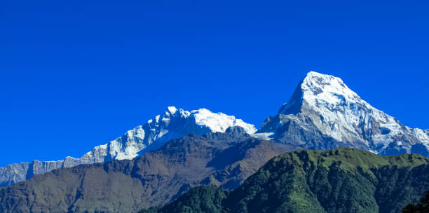 istock Beautiful and Amazing Snow-covered Mountain With Blue Sky 1199322791