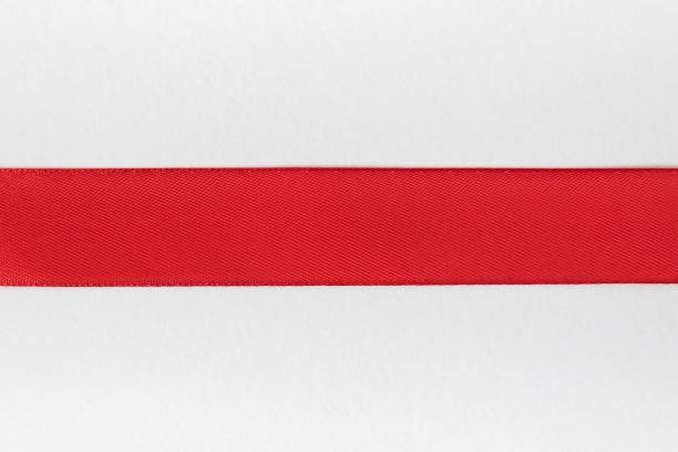 istock Horizontal red ribbon on a white background. Preparation for designer. Top view. Close-up 1199326884