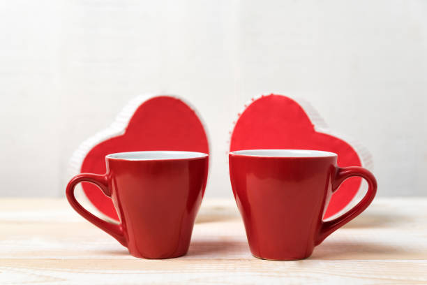 istock Two red cups and heart shaped boxes. Date, Valentine's Day. 1199327128
