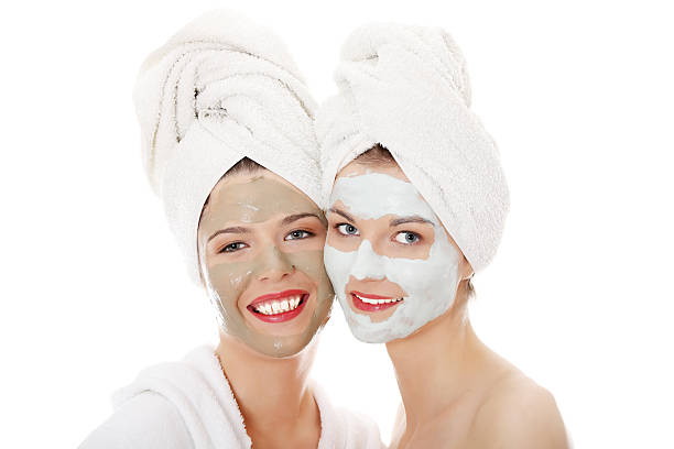 istock Two young womans with facial cream. 119933111